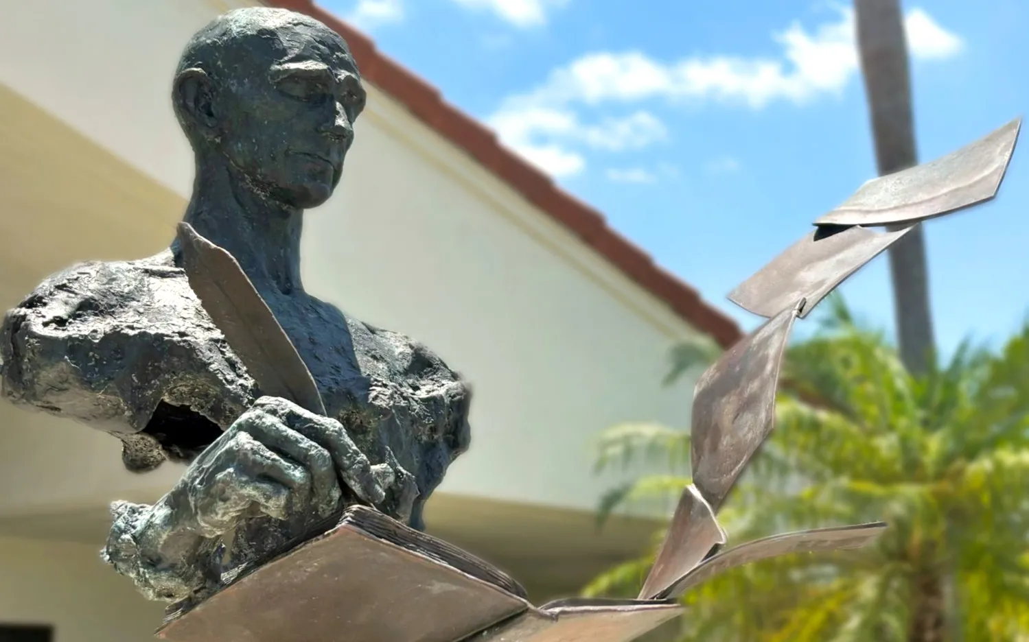 A statue titled "The Poet" located at the Hobe Sound Library