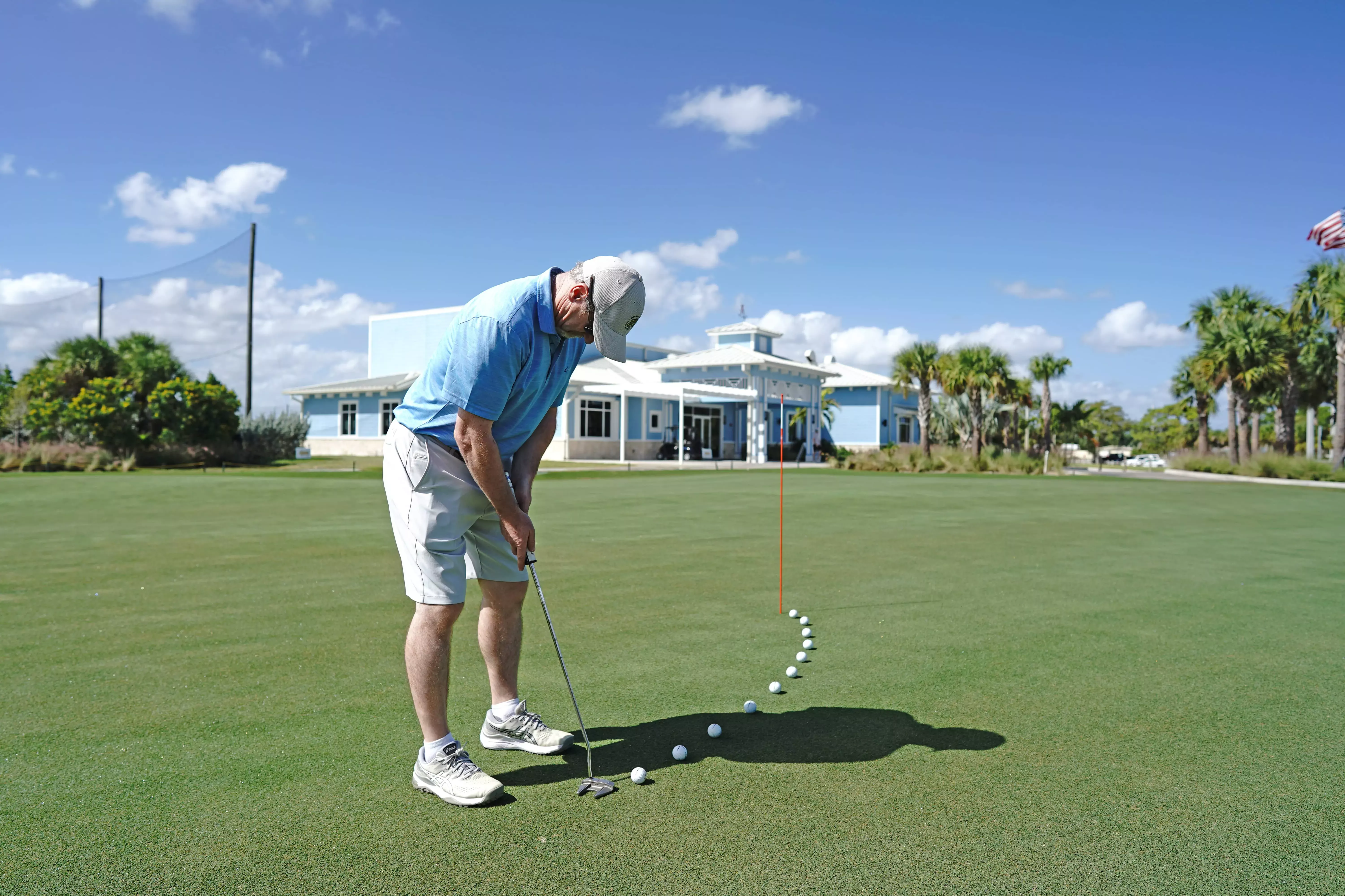 Image of a golfer on a putting green at Sailfish Sands Golf Course