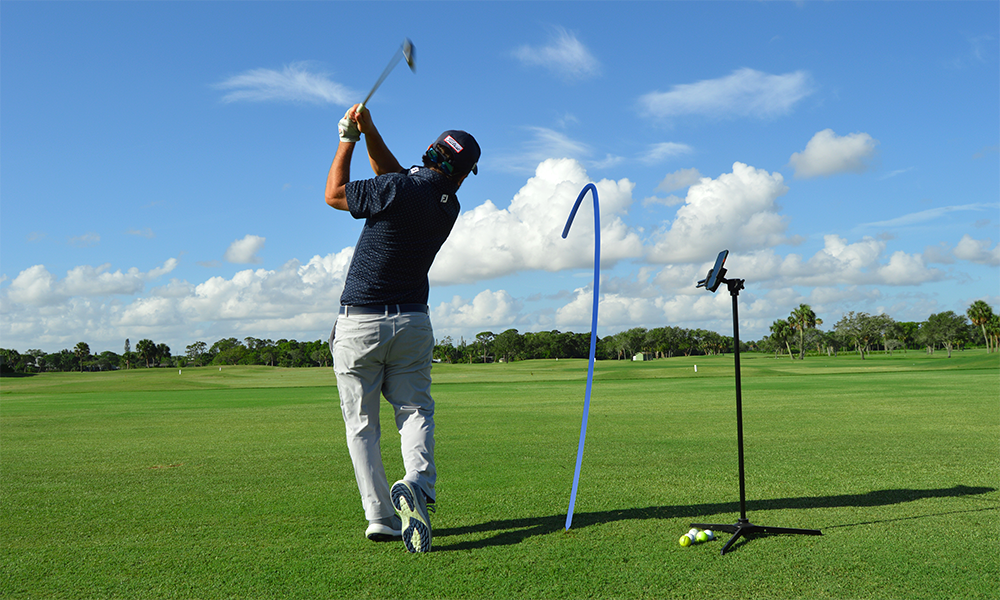A golfer swinging a golf club
