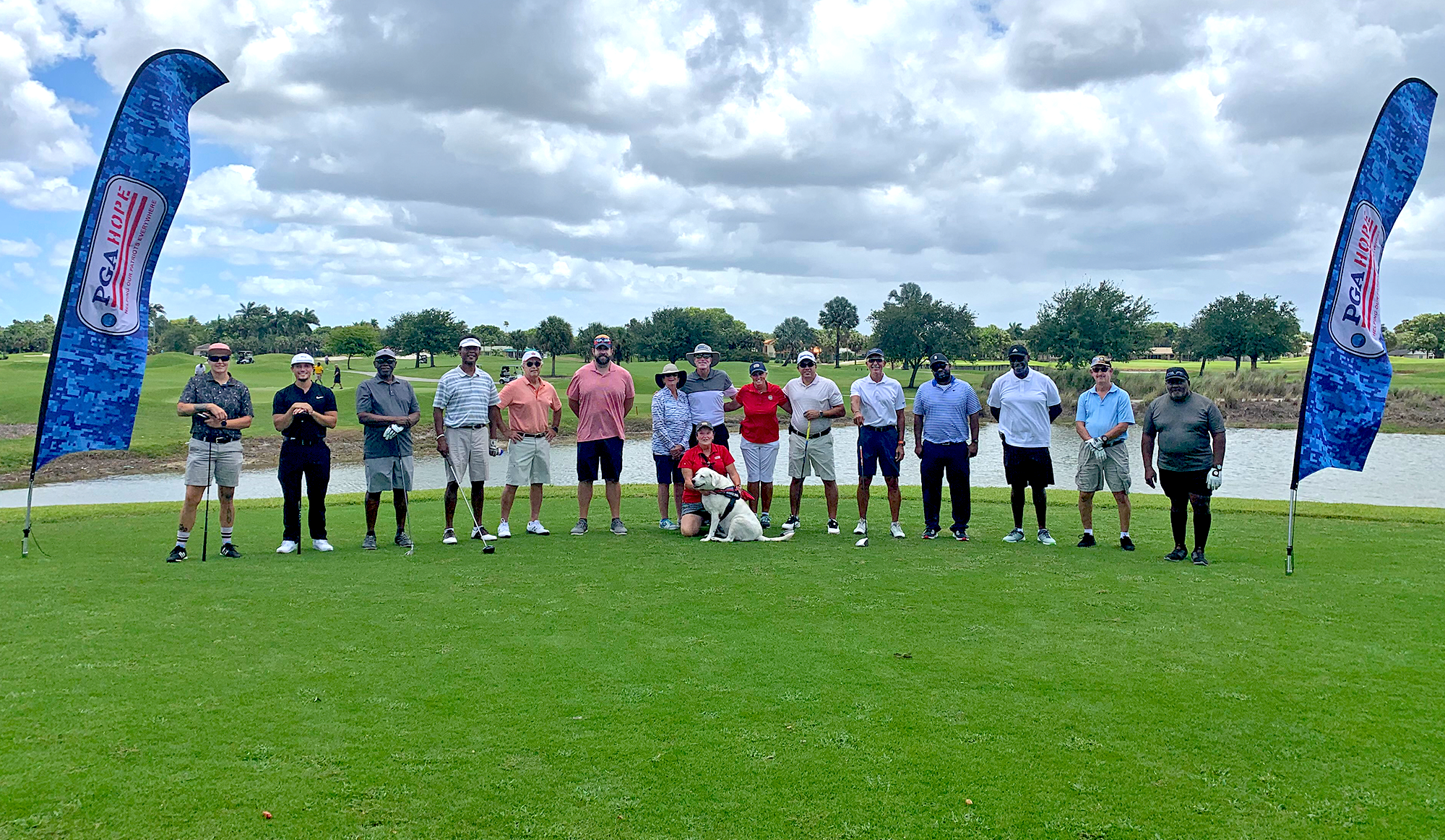 A group of veterans posing at Sailfish Sands Golf Course