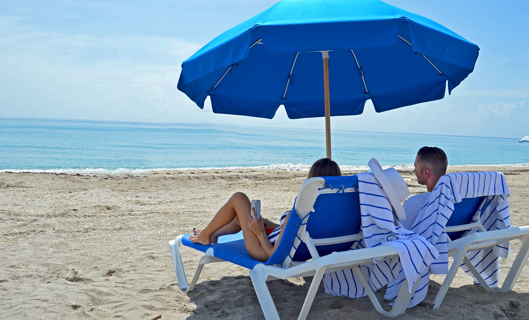 A couple enjoying beach chair rentals