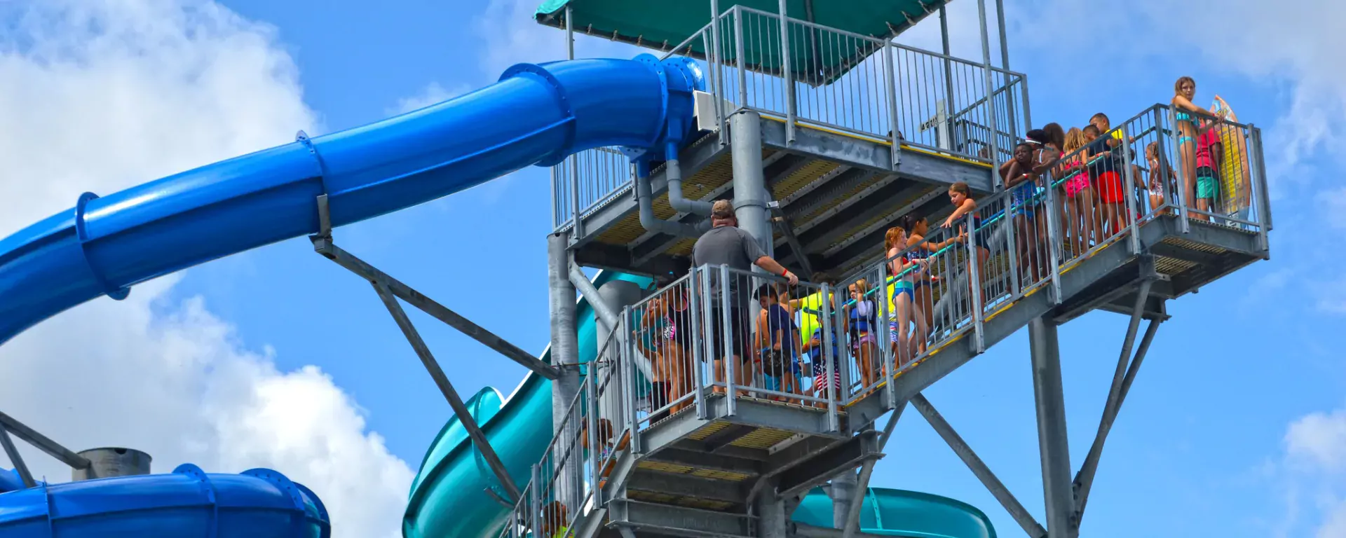 Image of Two four-story tall water slides including  a 253 foot closed flume “Speed Slide" at Sailfish Splash Waterpark in Stuart, FL. 