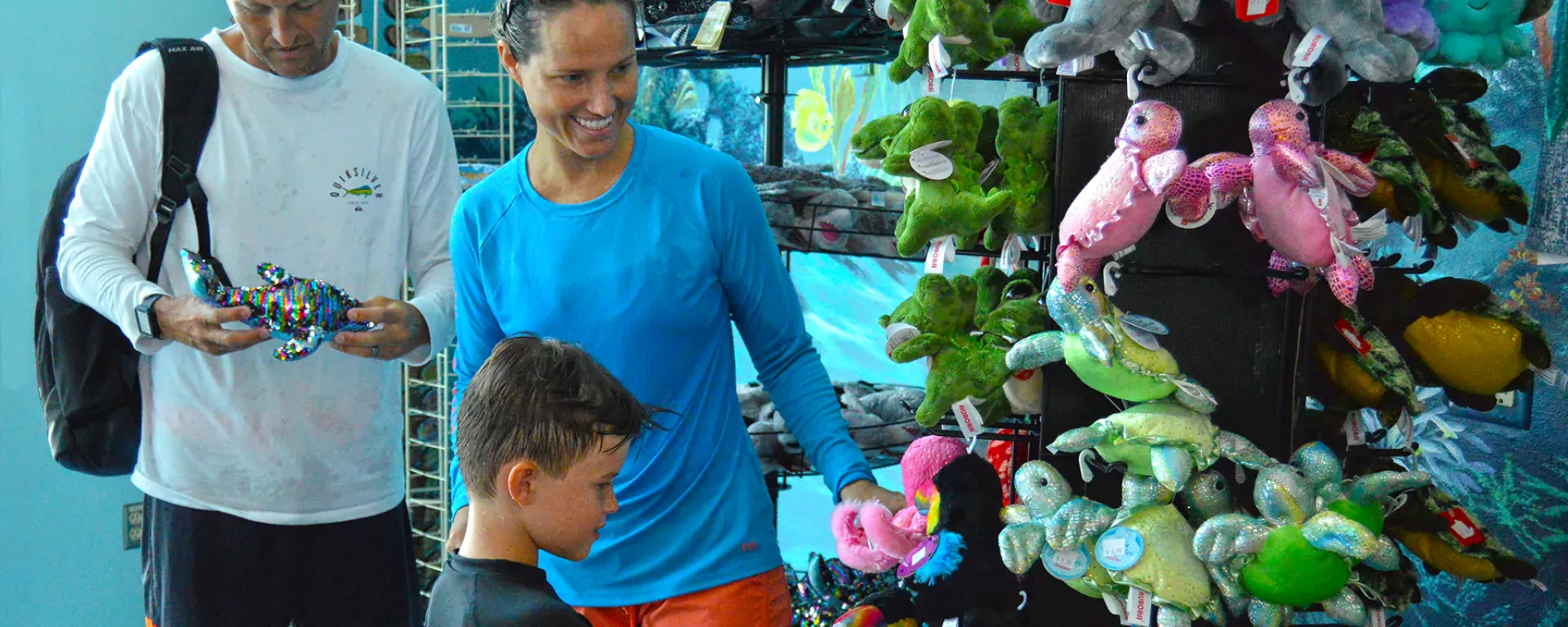 Image of a family looking at merchandise for sale at the gift shop at Sailfish Splash Waterpark in Stuart, FL.
