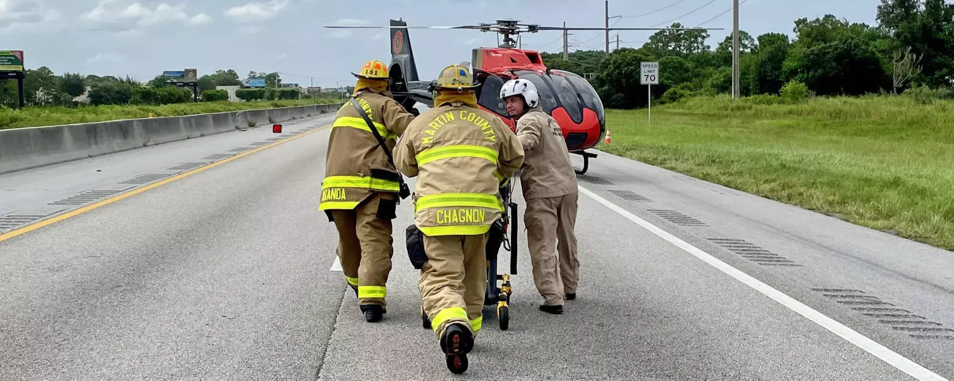 Crew on the highway in front of the LifeStar helicopter