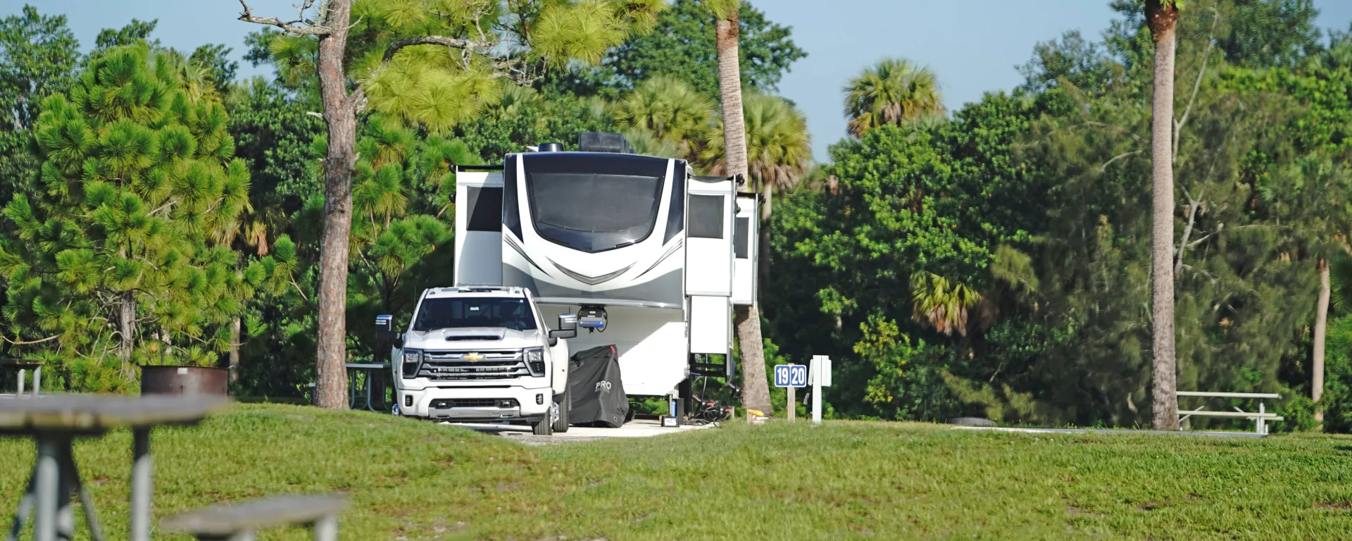 Truck and camper at a Phipps Park Campground site