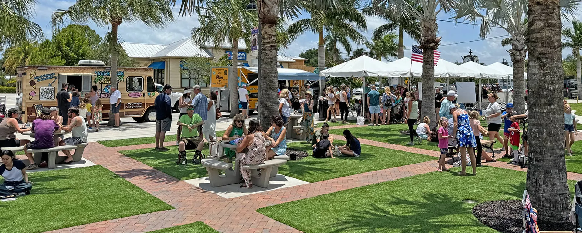 People gathered during an event held at the Patio at Palm City Place.