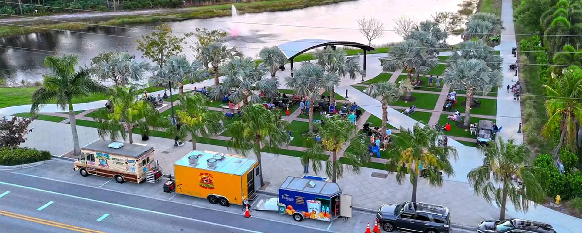 Food trucks and people enjoying the sunset at the Patio at Palm City Place.
