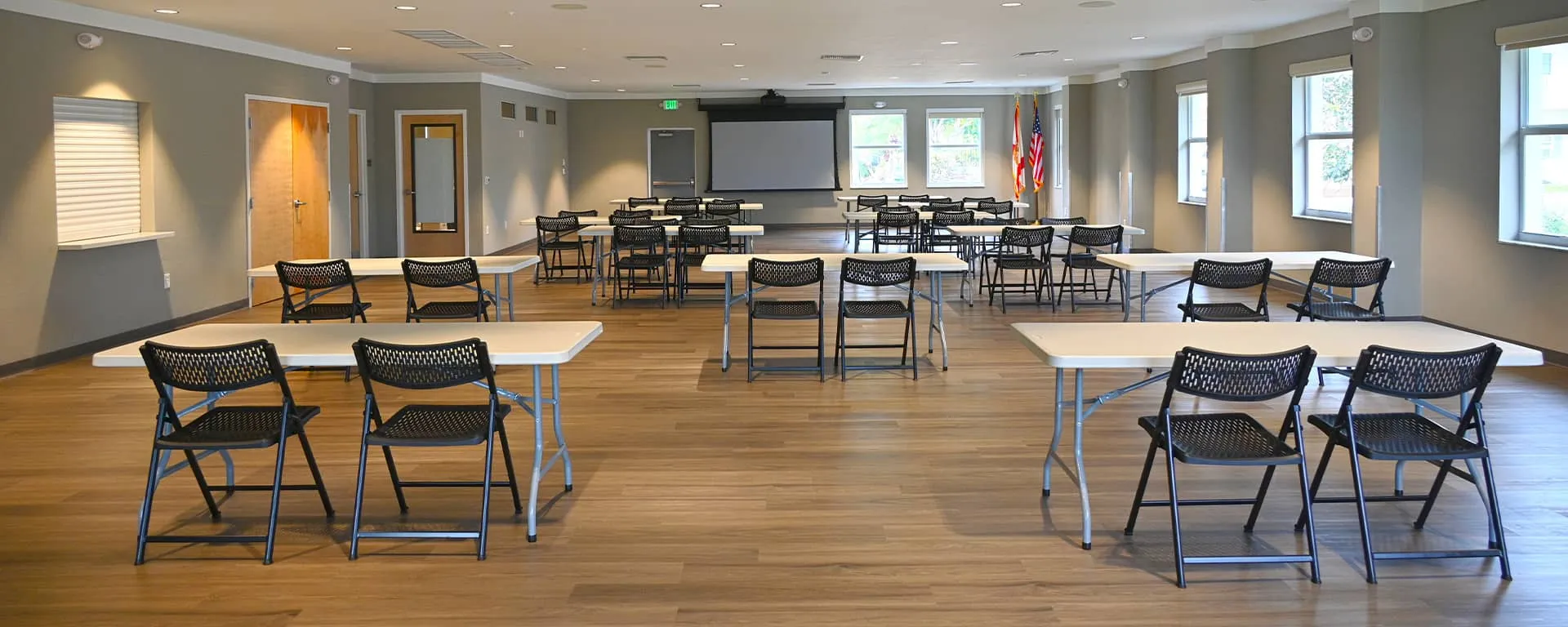 Interior space at the Palm City Community Center with tables and chairs arranged for an event