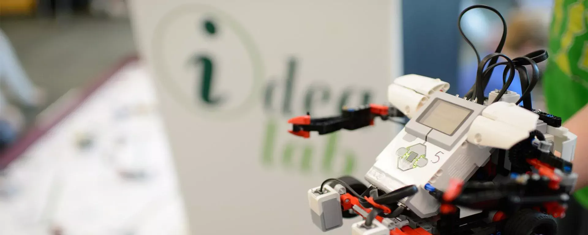 Image of a robot in front of the idea lab podium