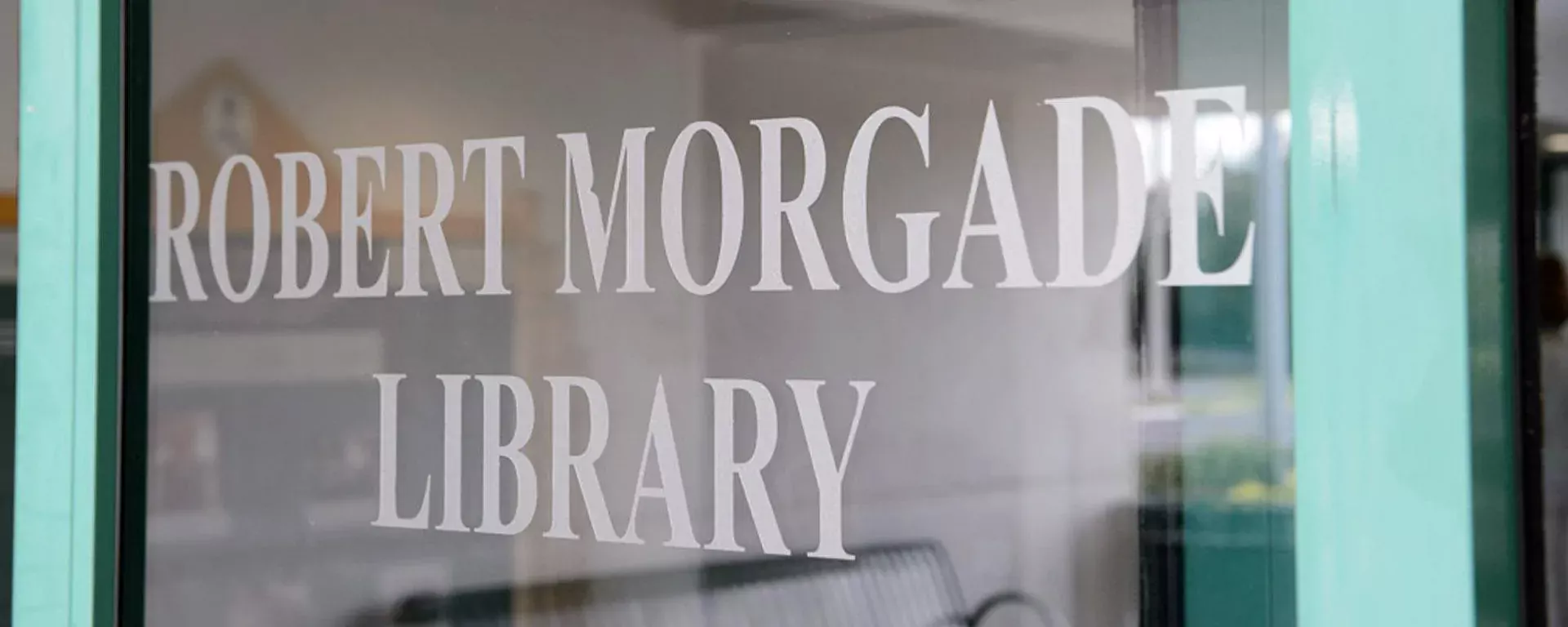 picture of the library's name on a glass door