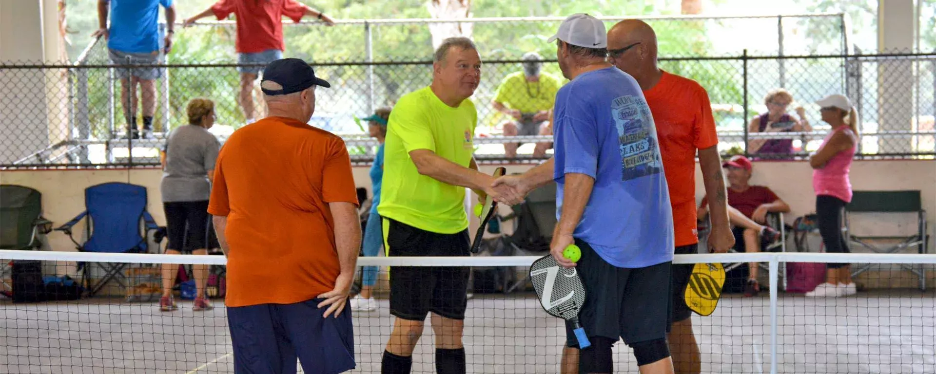 Pickleball game with men