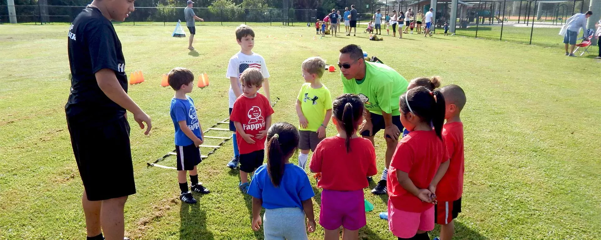 Youth soccer team meeting with their coach. 