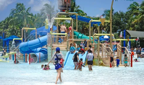 A lifeguard watching people around the Interactive Splash Playground at Sailfish Splash Waterpark