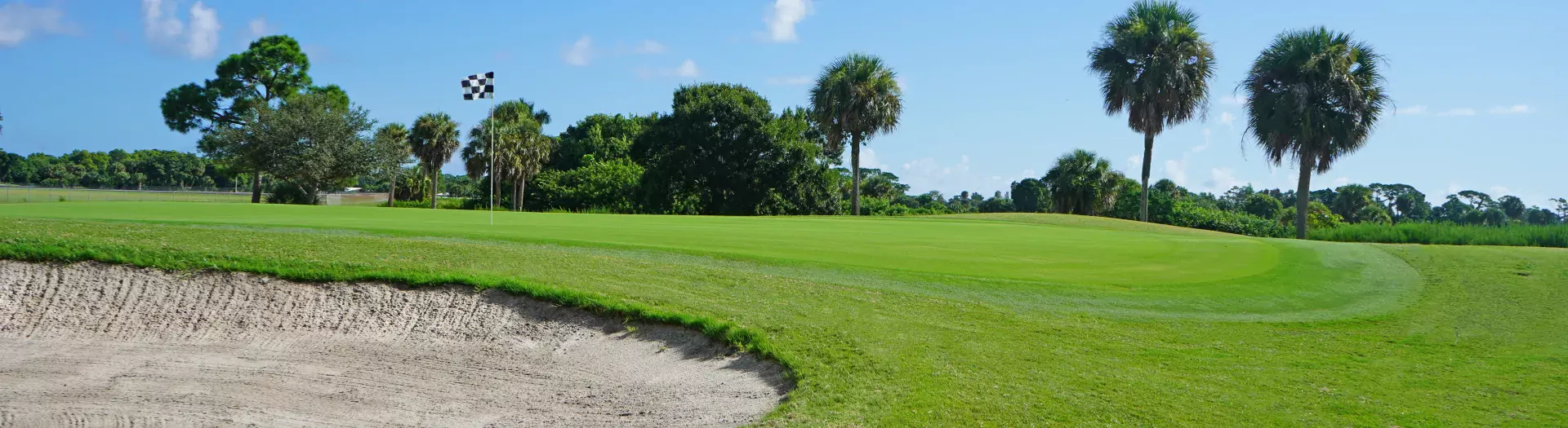 Golf greens of Sailfish Sands Golf Course with bunker