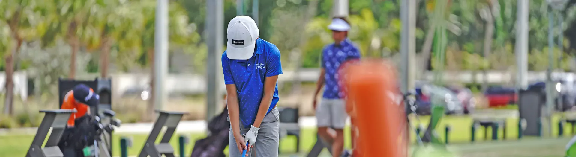 Image of a golfer on the driving range at Sailfish Sands Golf Course