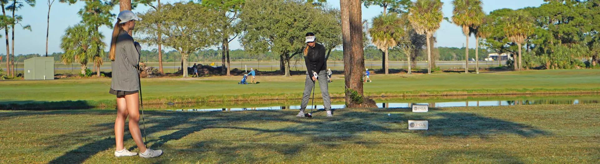 Image of two golfers on the Sailfish 18 Course at Sailfish Sands Golf Course