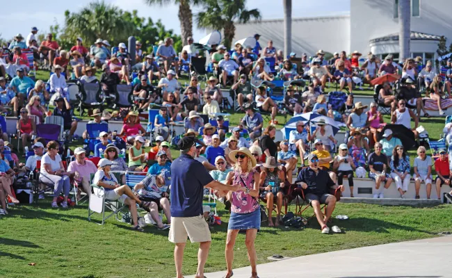 Two people dancing at the Music at the Mansion event at Indian Riverside Park in Jensen Beach