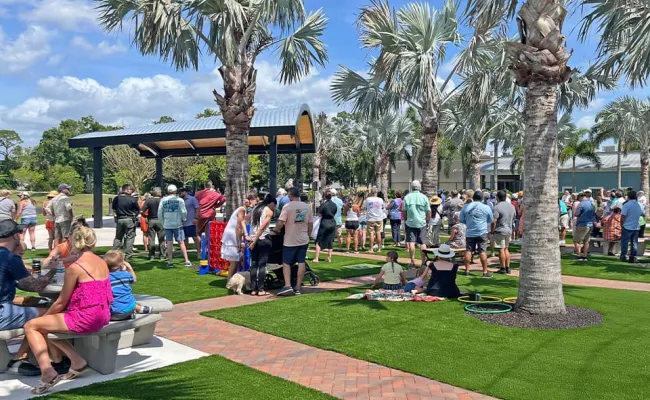 A crowd of people enjoying events at Palm City Place & Patio.