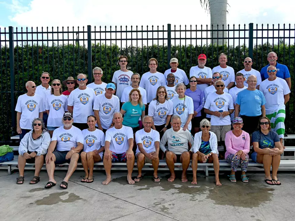 A group of Senior Games participants posing by the pool