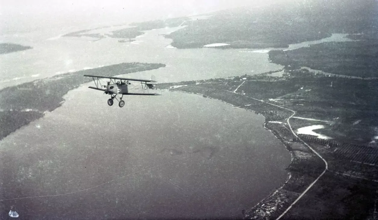 Aerial view of biplane in flight