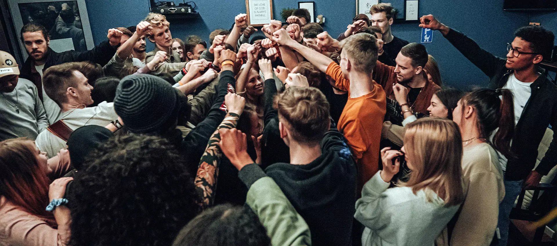 A group of teenagers standing together. Photo by S. H. Gue on Unsplash