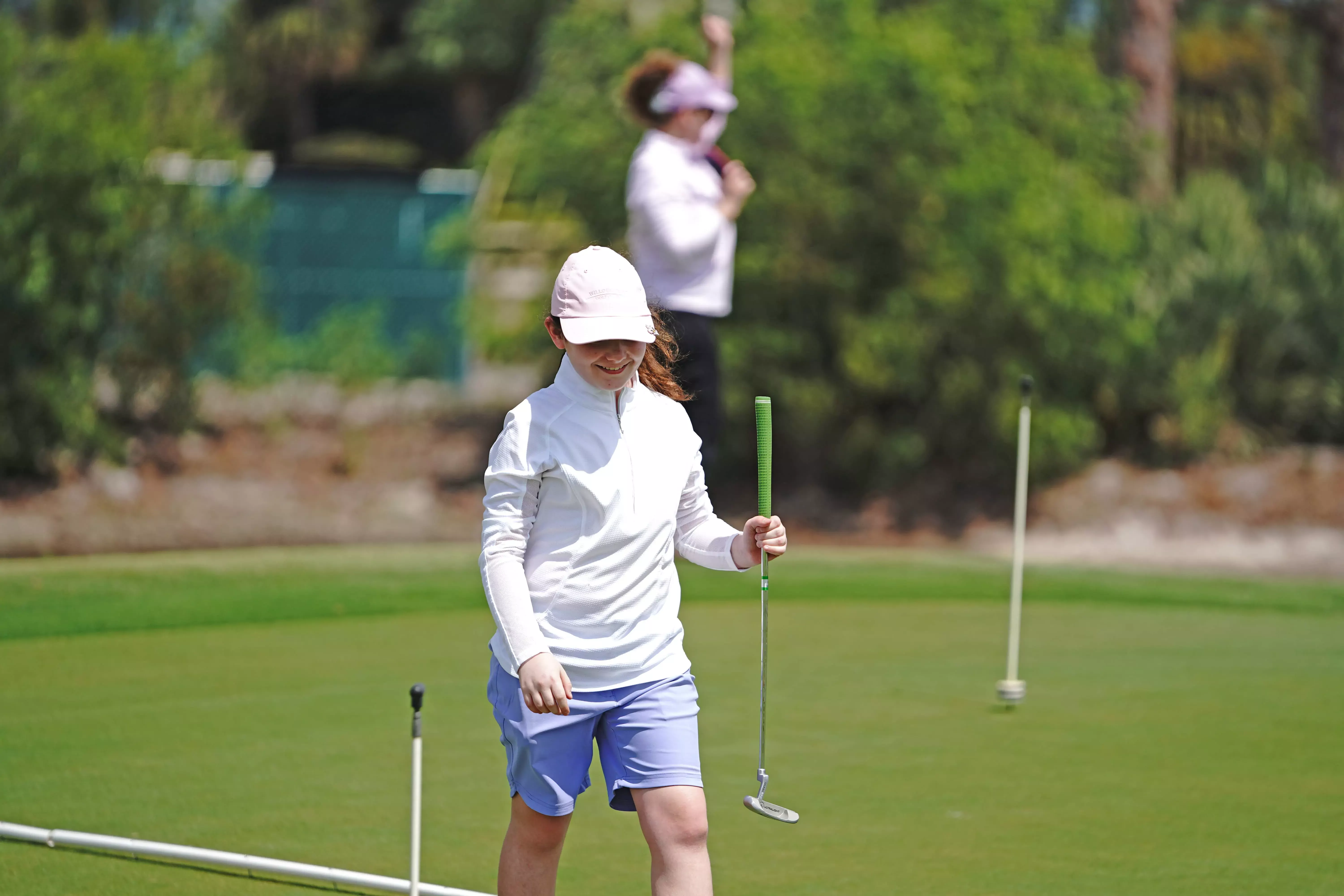 Image of a junior golfer on the practice green at Sailfish Sands Golf Course