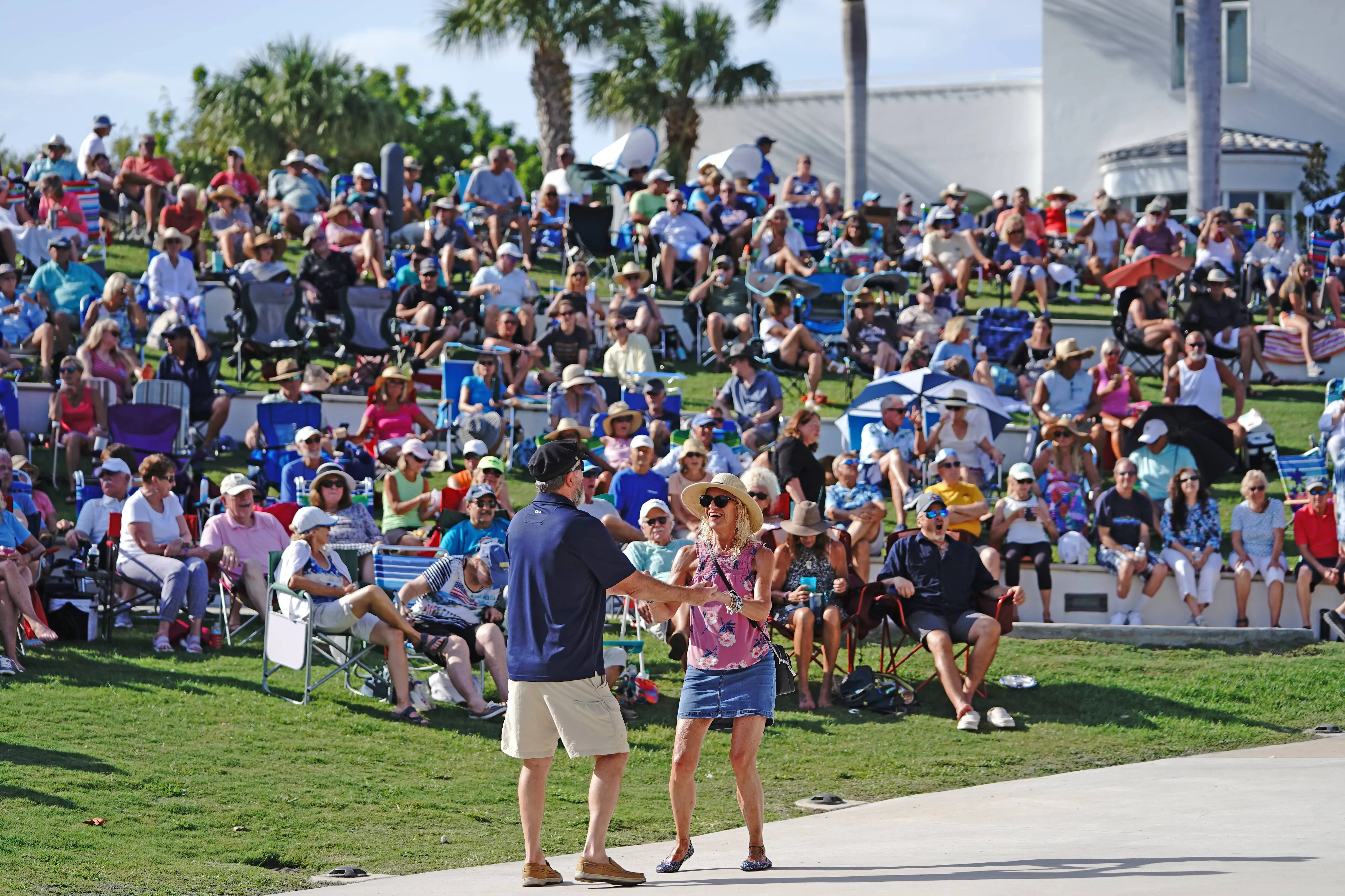 Two people dancing at the Music at the Mansion event at Indian Riverside Park in Jensen Beach
