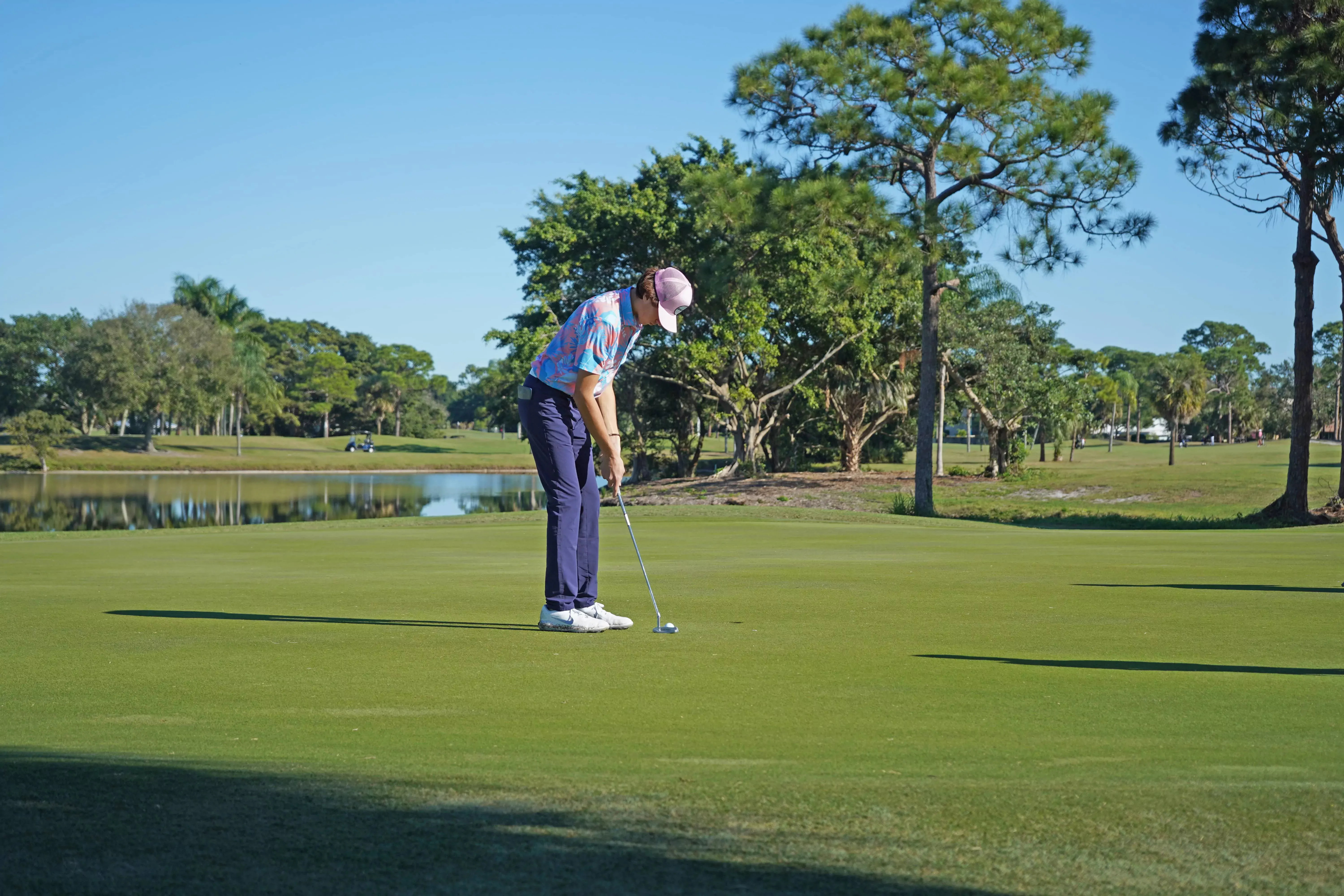 A golfer putting on Hole 9 of the Sailfish 18 Course at Sailfish Sands Golf Course