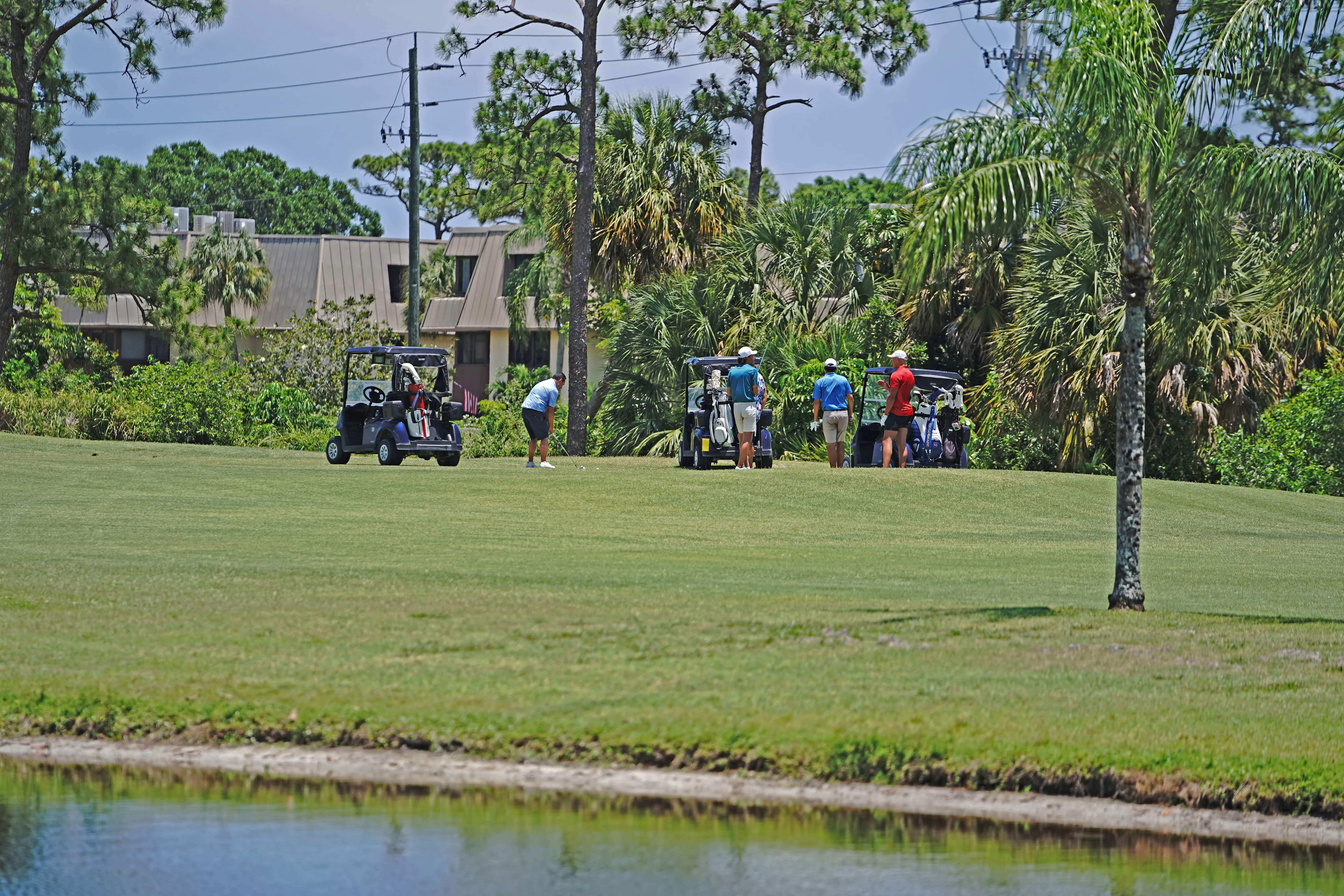 4 people on a fairway of the Sailfish 18 Course at Sailfish Sands Golf Course