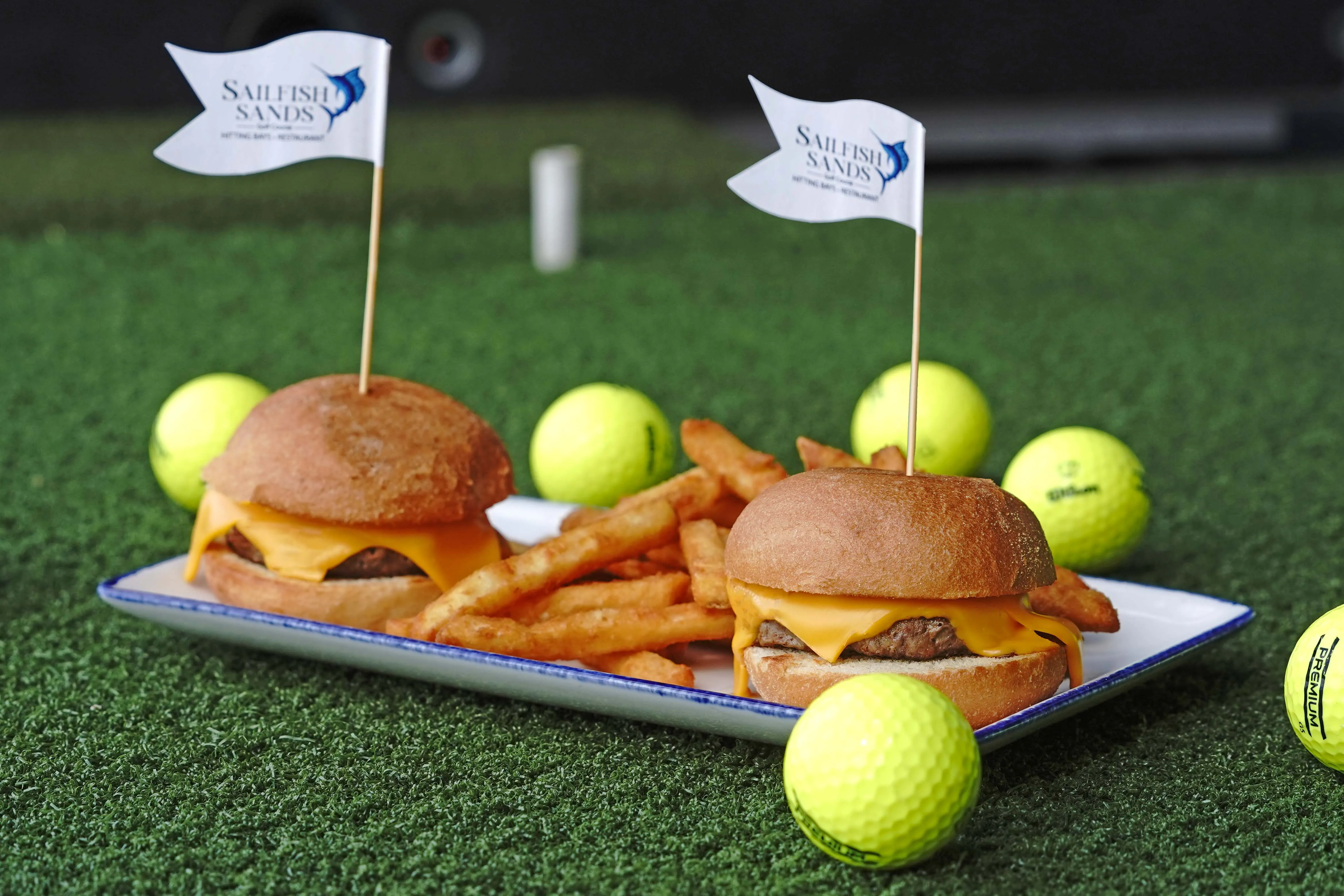 Two kids cheeseburgers with a side of fries