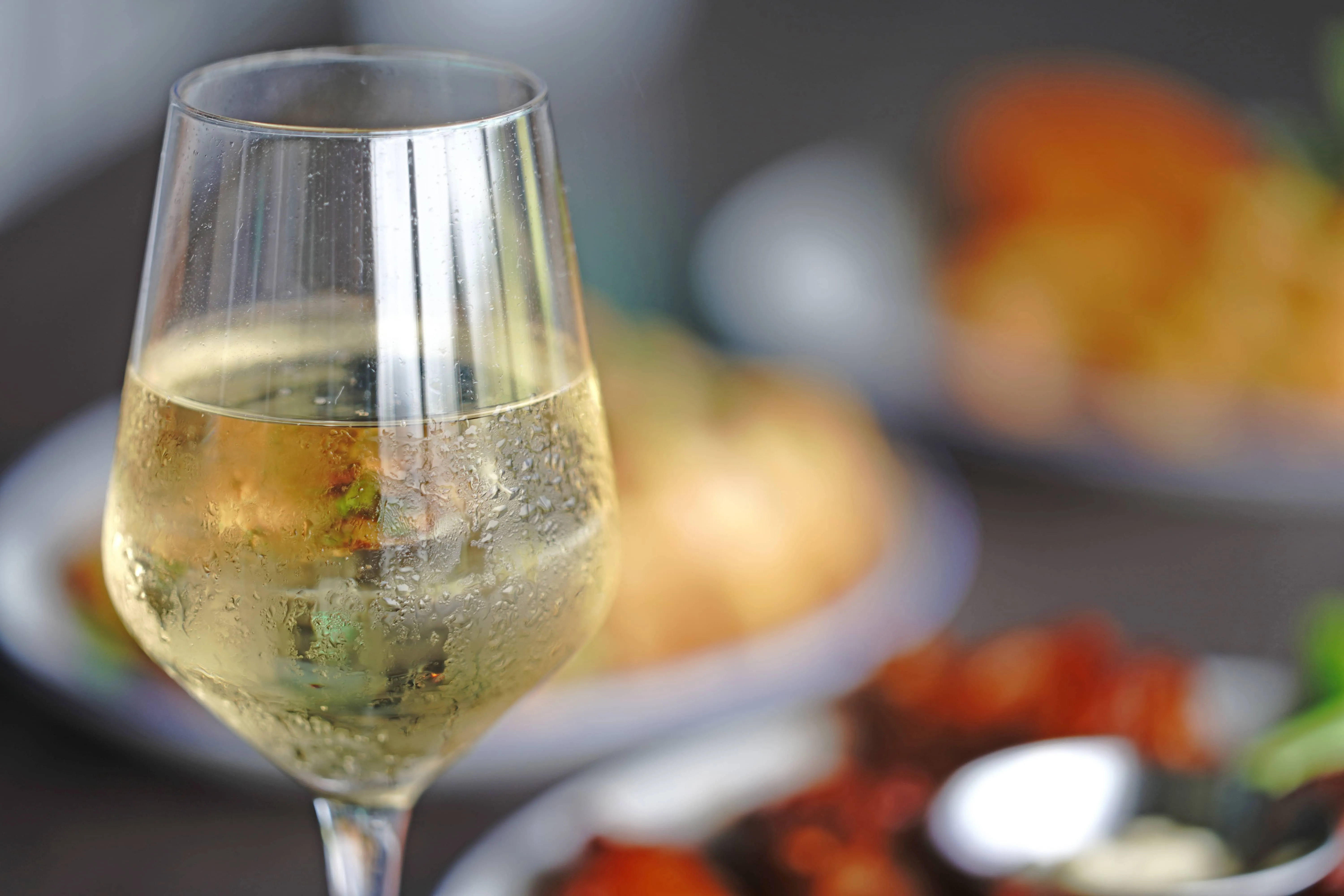 A glass of wine with appetizers at Sailfish Sands Hitting Bays