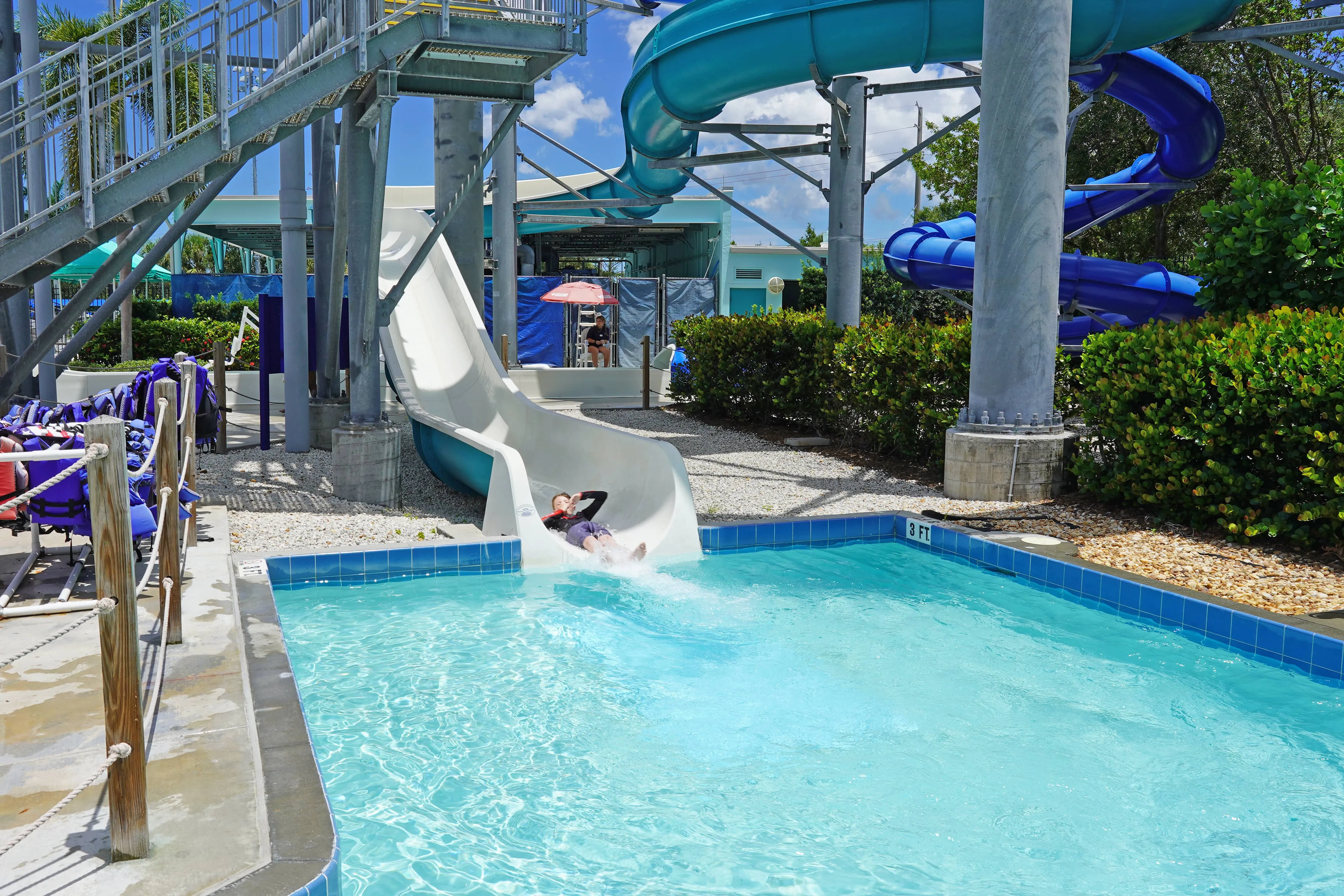 A kid coming down a slide at Sailfish Splash Waterpark