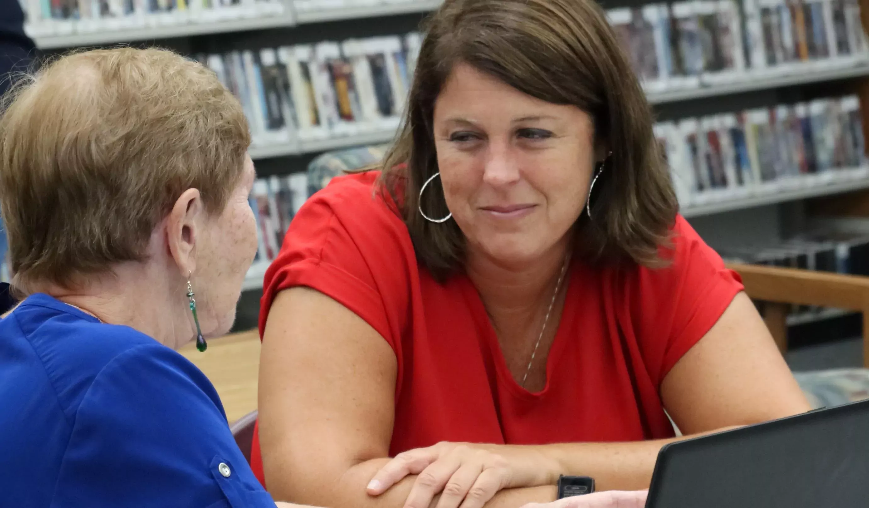 Picture of two adults collaborating at the Hobe Sound Library
