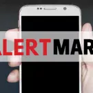 Alert Martin logo and a hand holding a phone